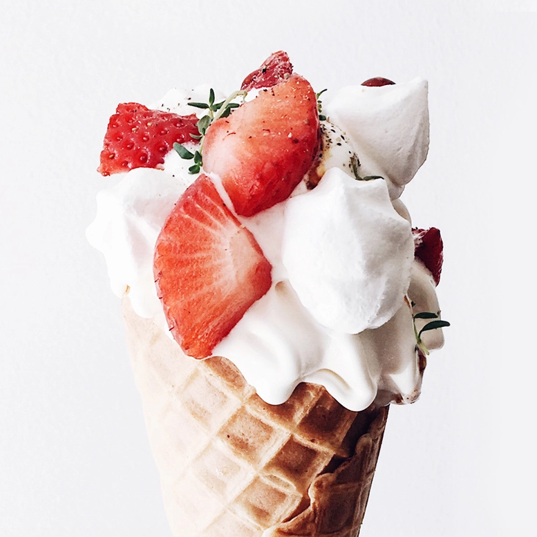 Bears Ice Cream, soft serve in a waffle cone with fresh strawberries